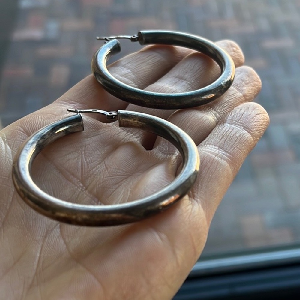 Sterling silver hoops.
